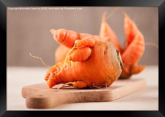 raw deformed carrot roots  Framed Print by Arletta Cwalina