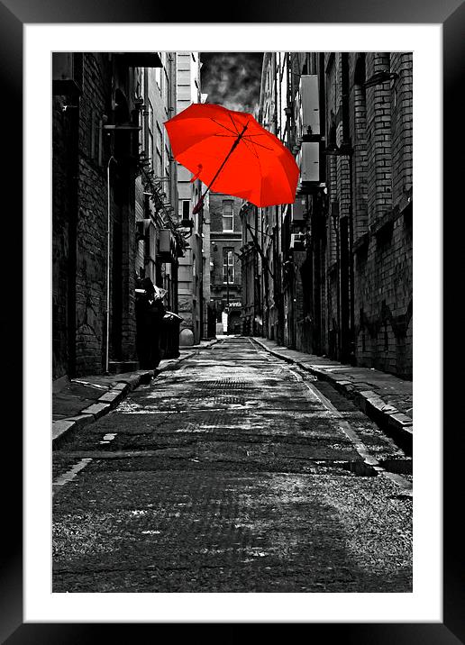 colorful iumbrella in a dark back street alley Framed Mounted Print by ken biggs