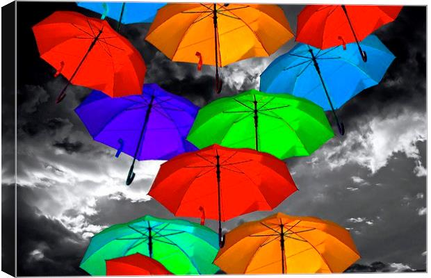 colorful umbrellas against a stormy sky Canvas Print by ken biggs