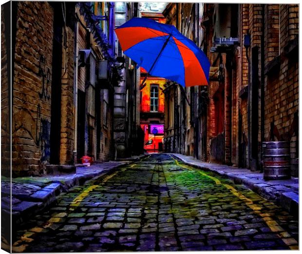 colorful umbrella in a dark back street alley Canvas Print by ken biggs