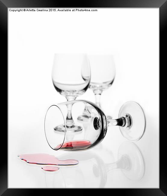 overturned wine glass with red wine splashed out  Framed Print by Arletta Cwalina