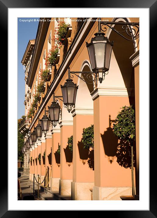 Row of lamps on columns of building  Framed Mounted Print by Arletta Cwalina