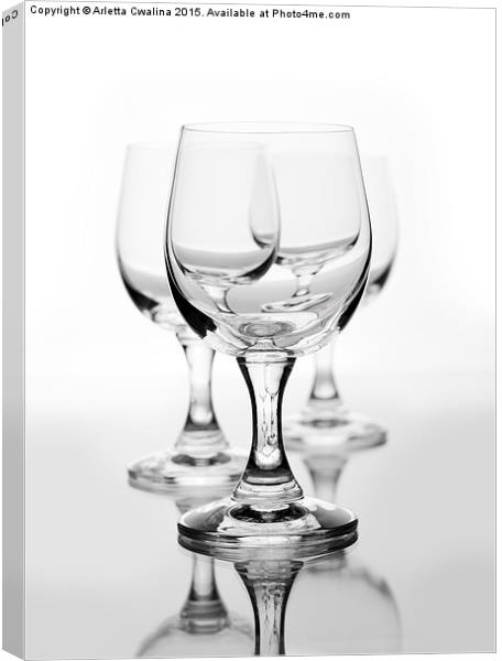 Three empty wine glasses on white  Canvas Print by Arletta Cwalina