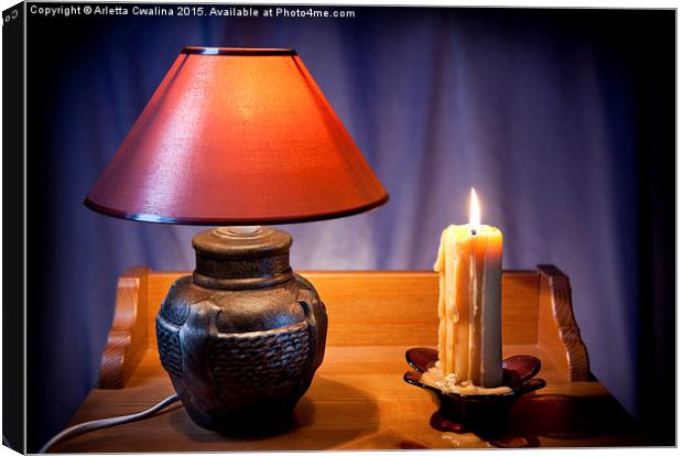electrical night light lamp and burning candle  Canvas Print by Arletta Cwalina