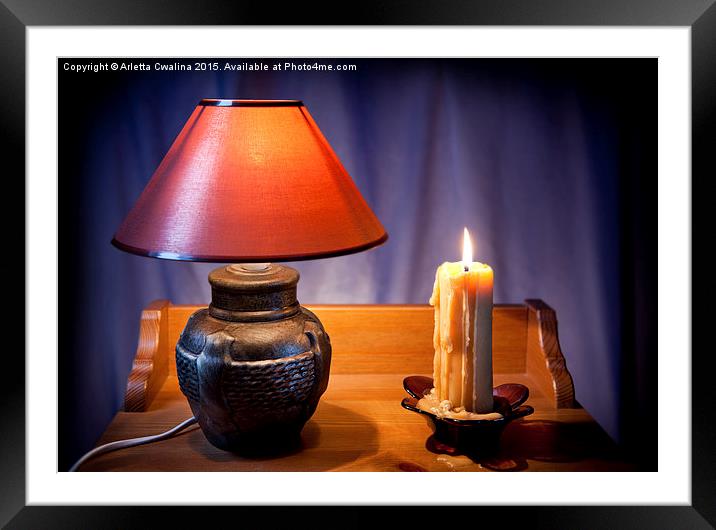 electrical night light lamp and burning candle  Framed Mounted Print by Arletta Cwalina