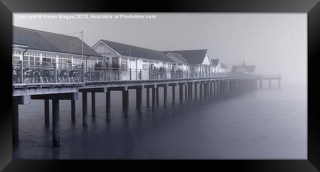 Southwold Pier vanishing into the mist Framed Print by Karen Magee