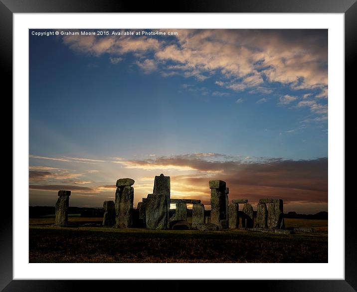 Stonehenge summer solstice sunrise Framed Mounted Print by Graham Moore