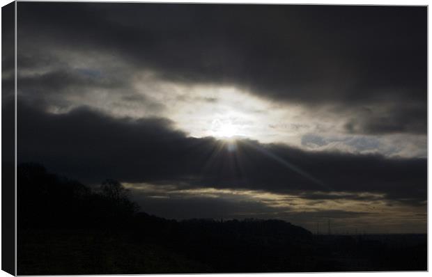 Sun Breaking Through the Clouds Canvas Print by David Moate