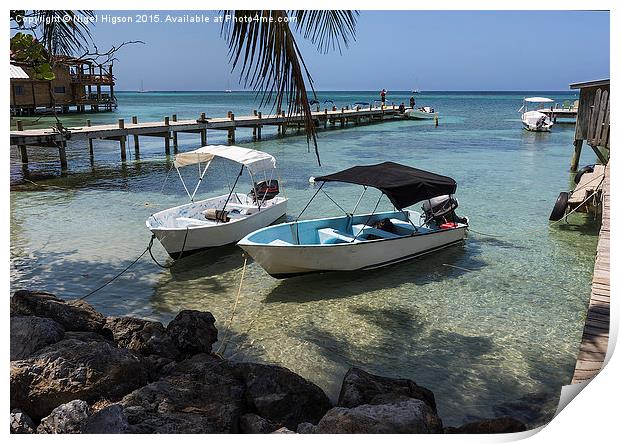  Boats rest in the clear waters of Roatan Print by Nigel Higson
