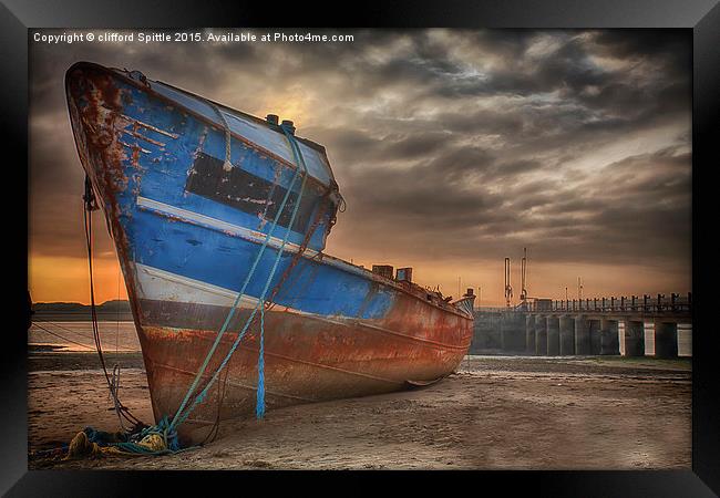  Old rusty ship being broken for scrap Framed Print by clifford Spittle