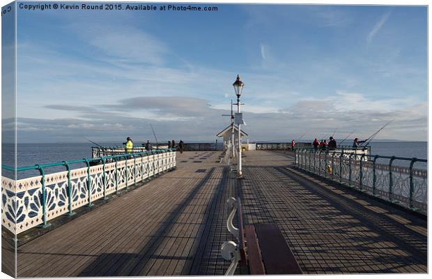 People fishing on Penarth Pier, Wales, UK Canvas Print by Kevin Round