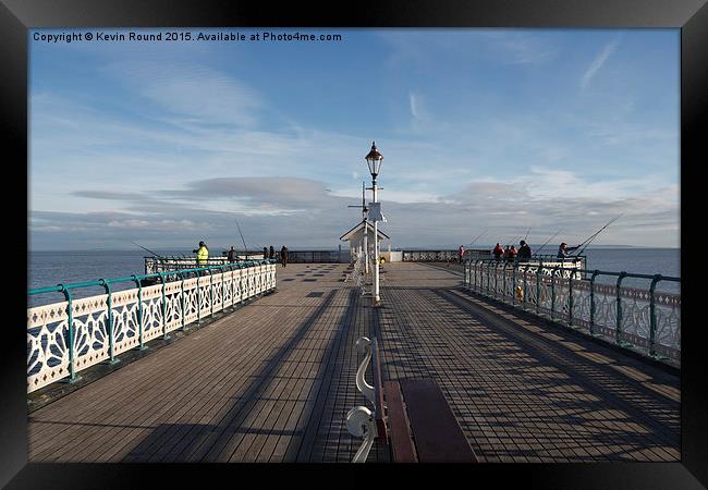 People fishing on Penarth Pier, Wales, UK Framed Print by Kevin Round