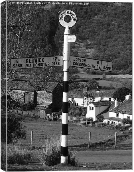 Sign post at Buttermere Canvas Print by Susan Tinsley