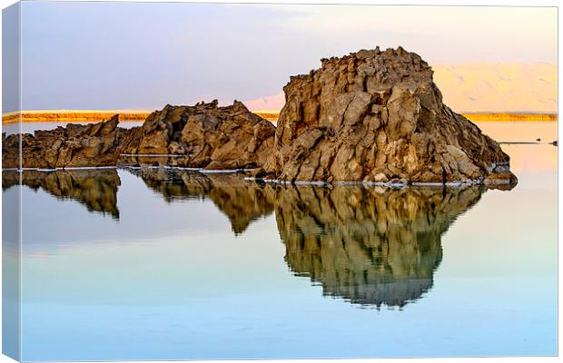 Rocks reflect in the still water Canvas Print by PhotoStock Israel