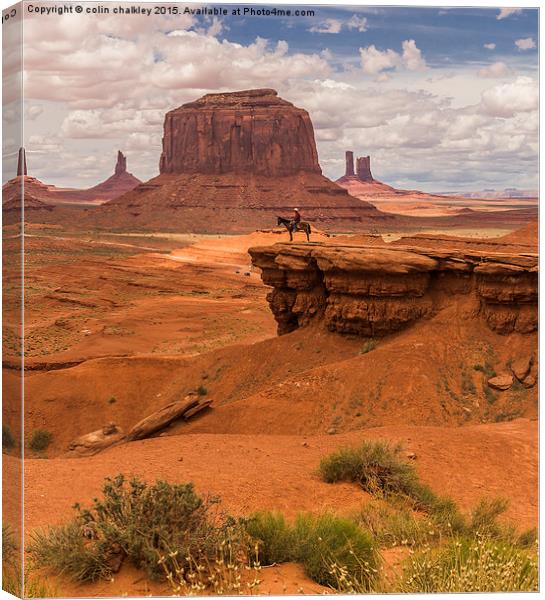  A Lone Horseman in Monument Valley, USA Canvas Print by colin chalkley