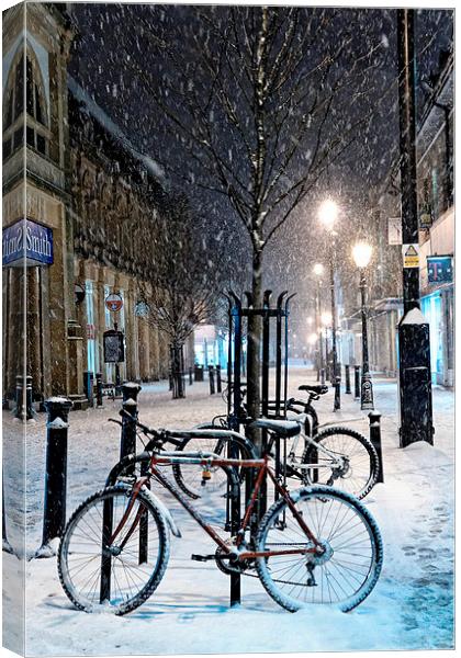  Cycles in the Snow, Cambridge Street, Harrogate Canvas Print by Paul M Baxter