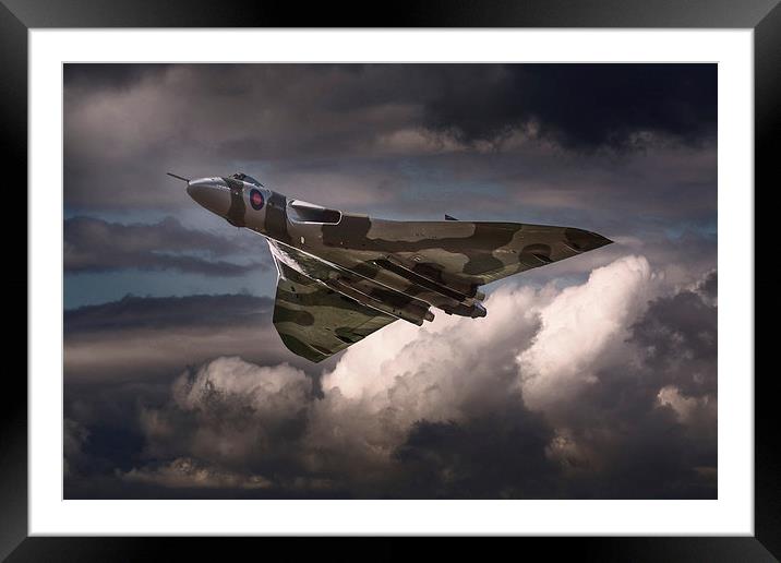  AVRO Vulcan XH558 cruising in moody sky Framed Mounted Print by Andrew Scott