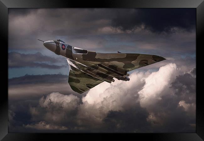 AVRO Vulcan XH558 cruising in moody sky Framed Print by Andrew Scott