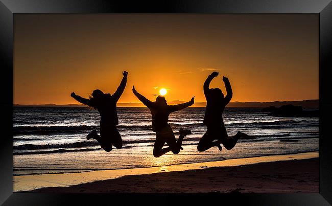  Jumping for joy ,on Druidstone beach. Framed Print by Philip Jones