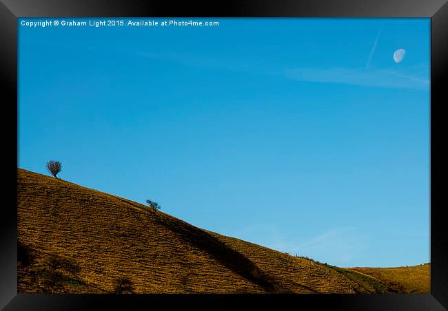  Barren landscape in the Peak district watched ove Framed Print by Graham Light