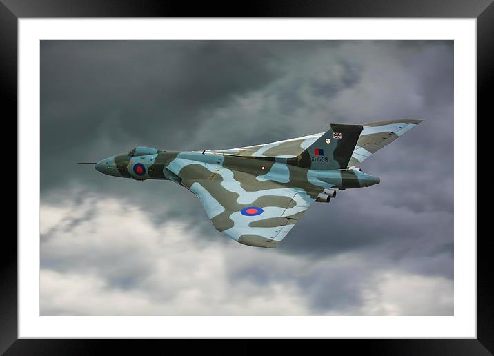  ARVO Vulcan XH558 flying low in moody skies over  Framed Mounted Print by Andrew Scott