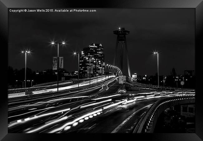  Traffic trails over the UFO Bridge at night Framed Print by Jason Wells