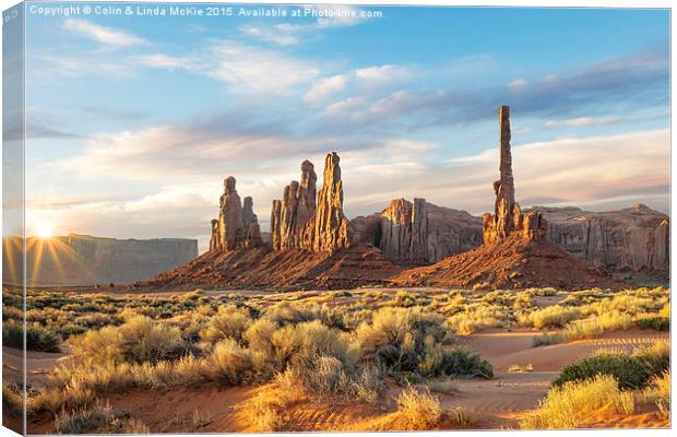 Monument Valley, Arizona at Sunrise Canvas Print by Colin & Linda McKie