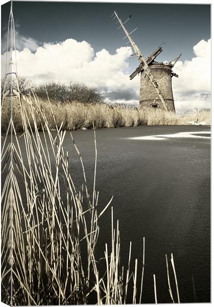 Brograve Mill by a frozen river Canvas Print by Stephen Mole