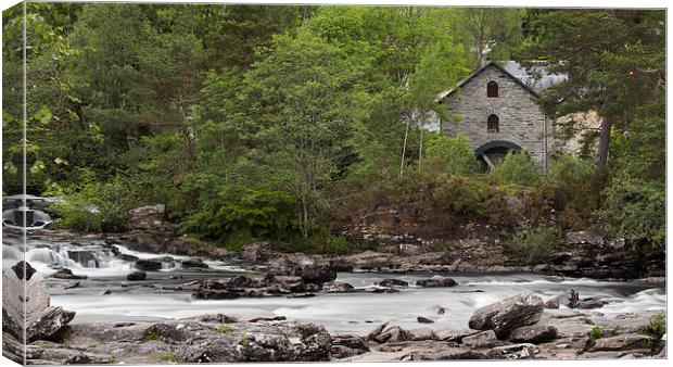 The waterwheel at the Falls of Dochart, Killin. Canvas Print by Tommy Dickson