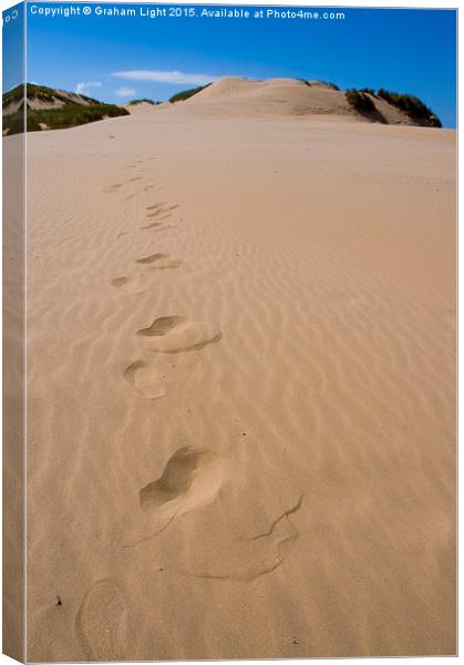  Footsteps in the sand Canvas Print by Graham Light