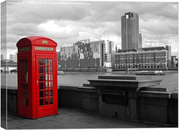 Traditional Red Telephone Box on Thames Embankment Canvas Print by Stuart Giblin