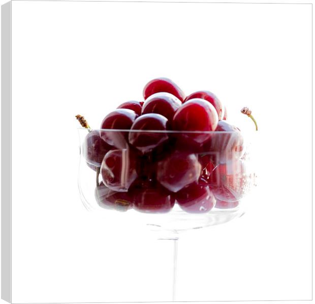 a glass of cherries Canvas Print by Adrian Bud