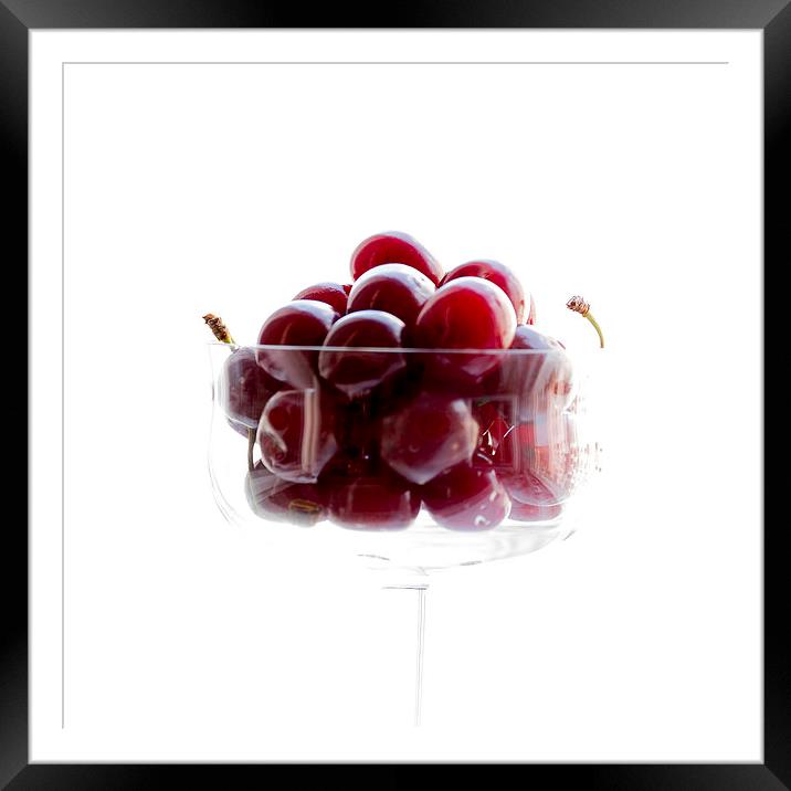 a glass of cherries Framed Mounted Print by Adrian Bud