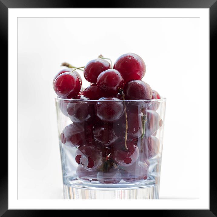 a glass with cherries Framed Mounted Print by Adrian Bud