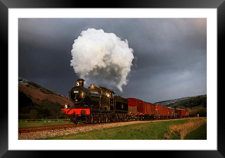 Goods train in the sun as a snowstorm approaches Framed Mounted Print by Ian Duffield