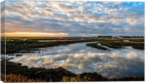  Sunrise over the quay or staithe at Thornham in N Canvas Print by Gary Pearson
