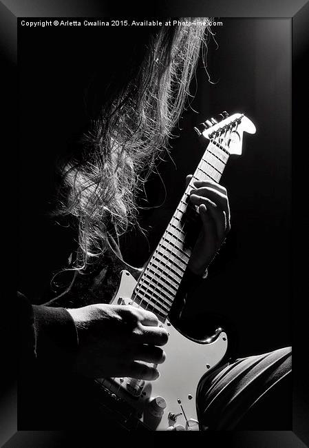 Long hair man playing guitar Framed Print by Arletta Cwalina