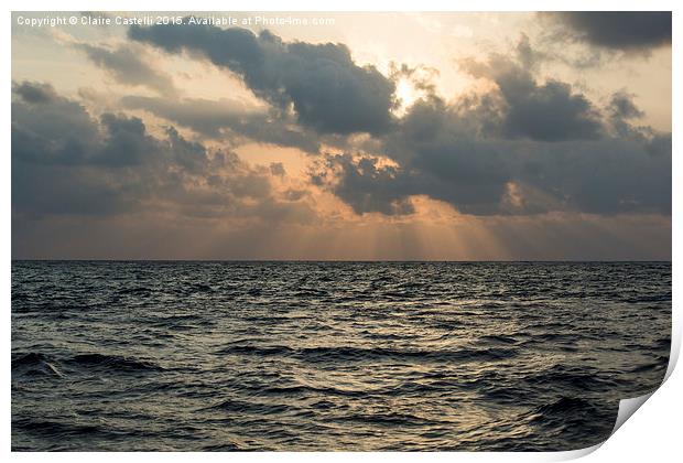 Sun rays over the ocean Print by Claire Castelli
