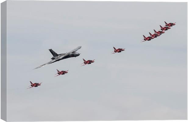 Red Arrows with Vulcan Canvas Print by J Biggadike