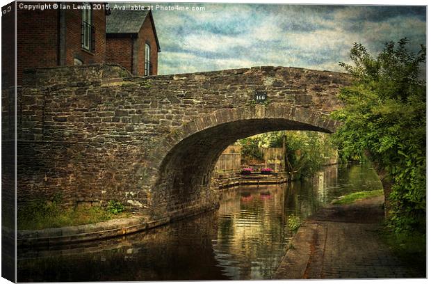  Canal Bridge In Brecon Canvas Print by Ian Lewis