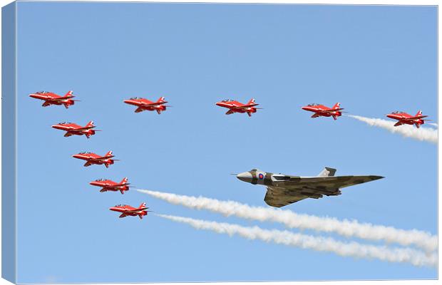 XH558 with The Reds Arrows Canvas Print by J Biggadike