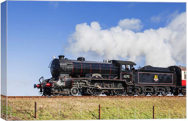 Steam train passing on an embankment  Canvas Print by Ian Duffield