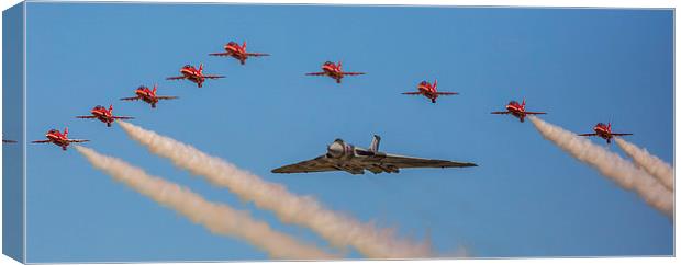  Avro Vulcan XH558 and the Red Arrows perform a fi Canvas Print by stuart bennett