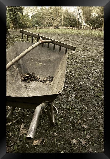 Wheelbarrow and wooden rake Framed Print by Stephen Mole