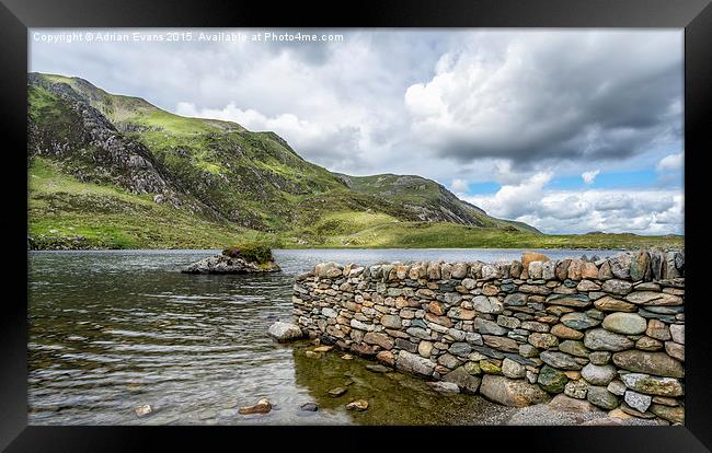 Lake at Idwal Framed Print by Adrian Evans