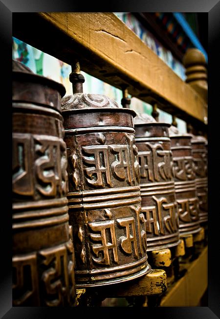 Tibetan Buddhist prayer wheels of Boudhanath stupa Framed Print by Julian Bound