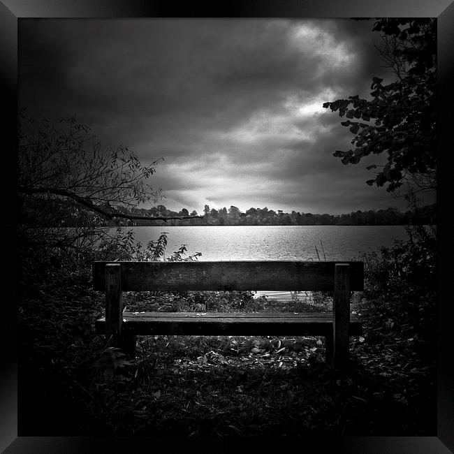  A lone bench in Ellesmere, Shropshire Framed Print by Julian Bound