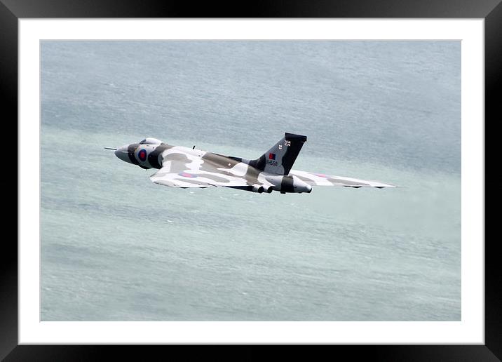 Vulcan XH558 Over The Water Framed Mounted Print by J Biggadike