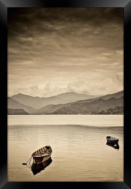  Lone boats on Fewa Lake, Pokhara, Nepal Framed Print by Julian Bound