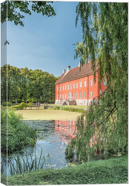 Hviderup Slott with reflection in moat. Canvas Print by Antony McAulay